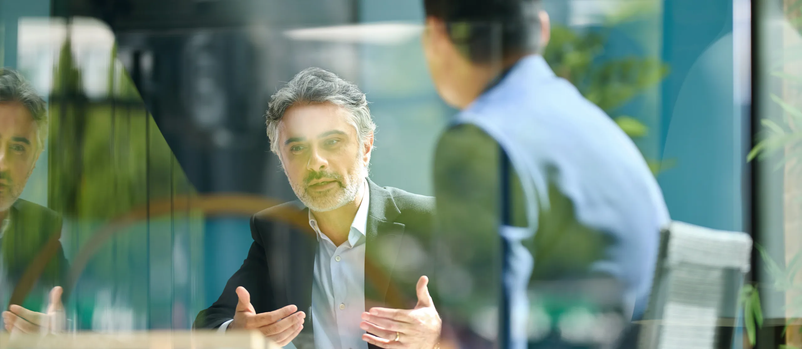 An advisor working with clients at Meketa Investment Group