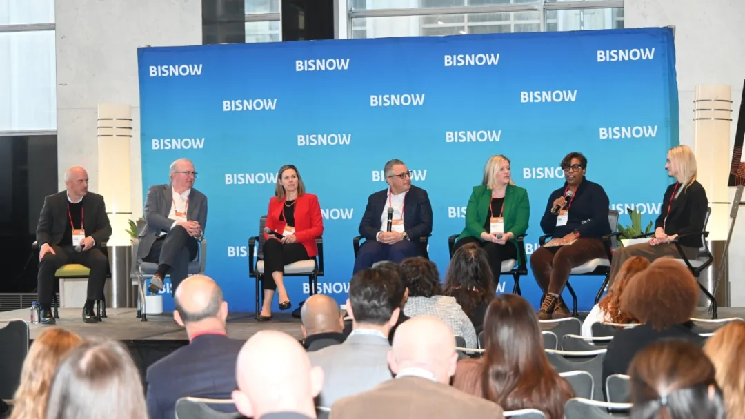 Philadelphia 2026 is Bigger Than a Moment, It’s a Long Game Panelists speak at a Bisnow Philadelphia 2026 forecast event, discussing real estate, infrastructure, and long-term growth as attendees watch from the audience.