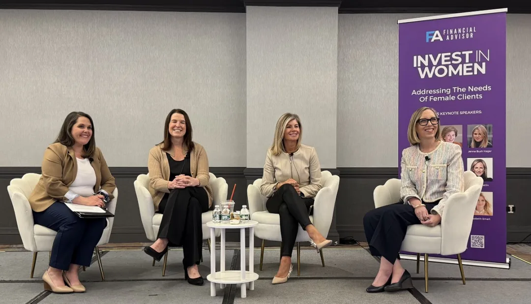 Invest_In_Women_2026 Four women on a panel stage at the Invest in Women conference, discussing marketing strategy in financial services.